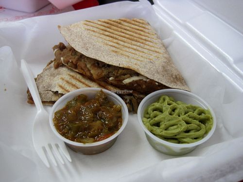 Quesadillas (whole wheat tortilla, refried beans, vegan cheese, vegan chicken, served with salsa and guacamole). This is a good option if you don't feel like eating Middle Eastern cuisine, which is 57Cals' specialty. at 57 Cals in Laval