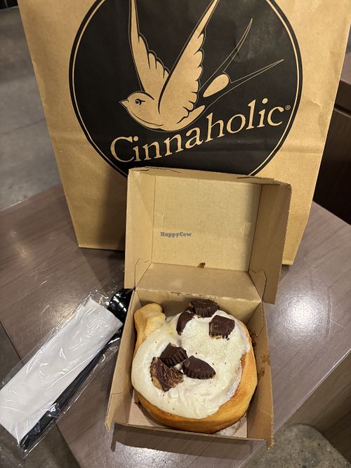 I built my own, with cream cheese frosting and peanut butter cups. Warm and yummy!  at Cinnaholic in New York City