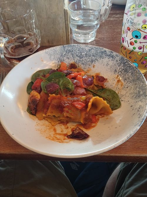 Truffle ravioli with spinach in a spicy tomato sauce. at Pembroke Primrose Hill London in London