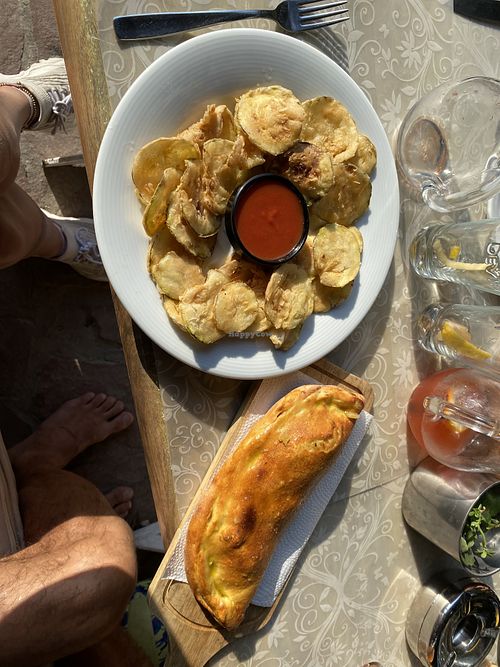 Fried zucchini with the tomato sauce from the  pizza and a delicious garlic flat bread   at Ресторант ВКЪЩИ in Varna