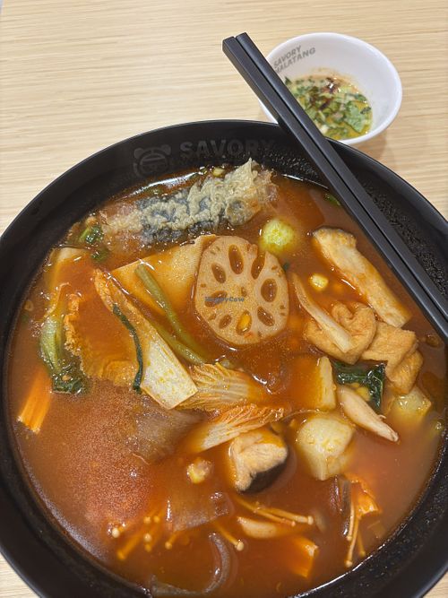 Malatang noodle soup with tomato broth  at Savory Malatang in Bangkok