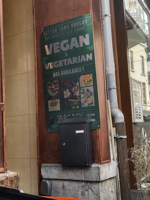 Sign advertising vegan options at The Noodle Bar in Brussels