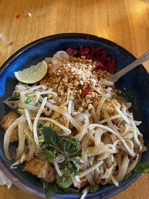 Wok fried phở noodles with bean sprouts, chilli, garlic, lemongrass, and fried tofu  at Eat Vietnam bar-b-grill in England