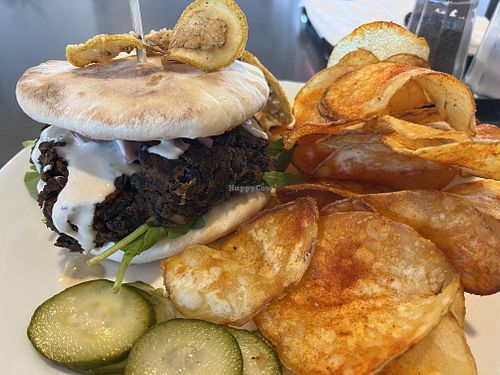 Black bean burger with fried lemon, bread and pickles made in house at Empanada Stop in Gresham