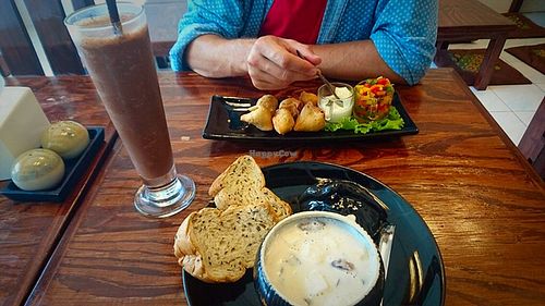 cream of mushroom soup and samosas  at Mango in Bangkok