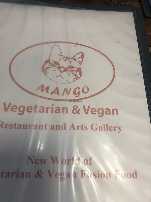 The menu cover which includes a drawing of a cat since there are plenty of cats lounging around inside at Mango in Bangkok