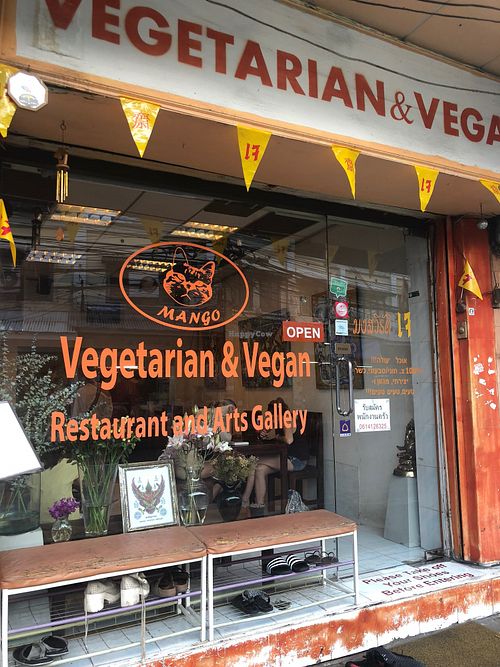 Exterior shot with cute artwork on the walls  at Mango in Bangkok