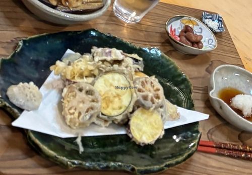 ShoLight, crispy, and completely plant-based.
Seasonal vegetables like lotus root, sweet potato, and shiitake jin style tempura  at Izuho - 民泊 いづほ in Mie