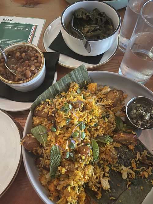 Masala coconut collard greens, vindaloo baked beans, and plantain biryani 🤤   at Grann in Tacoma