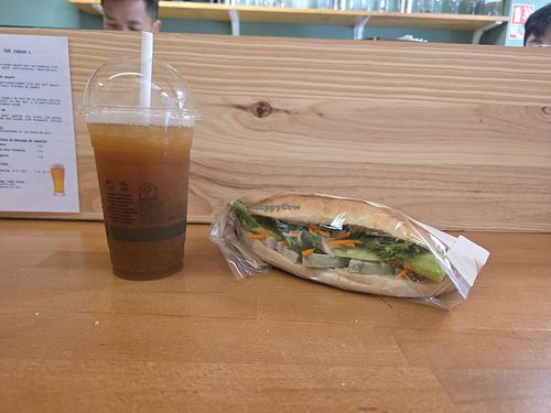 Passion fruit tea and banh mi Chay (vegan soy mortadella inside) at Bánh Cuốn 33 in Nouvelle-aquitaine