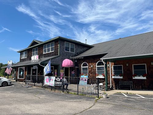 Outside of cafe with live musician.  at The Beach Rose Cafe in Charlestown
