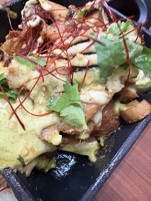 Loaded potatoes!!! Our favorite dish!! My mom would be so mad at me for filling up on potatoes at a fancy restaurant but WORTH IT  at Tane Vegan Izakaya - Highland Park in Los Angeles