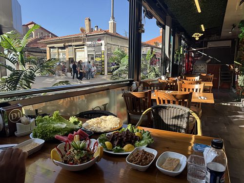 I took a picture before they brought out the roasted eggplant salad. It was also amazing!  at Kervan Urfa Sofrası in Kepez