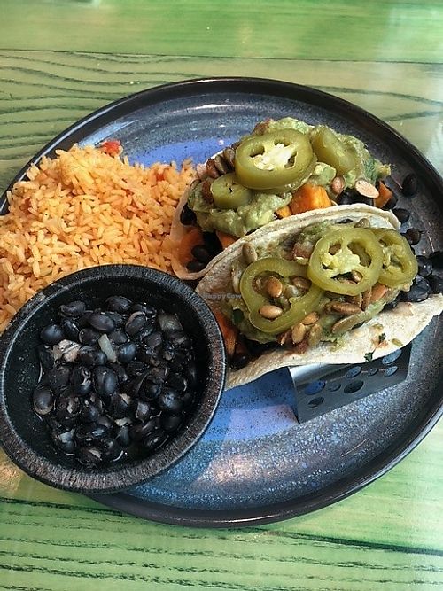 Sweet potato tacos on soft corn shells.  Ask for no cheese, and sub the refried beans to black beans.  Delicious and filling! at Gorilla Taco in Pigeon Forge