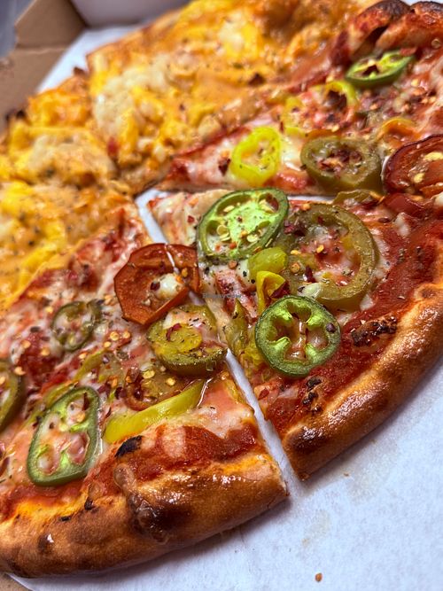 Vegan Fire Edition - 
Vegan cheese, pickled jalapeños, cherry peppers and banana peppers (All vegan products are soy free) at On The Run Pizza - Ghost Kitchen in Las Vegas