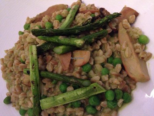 Farro risotto with English peas, asparagus and trumpet mushrooms at Equinox Restaurant in Washington