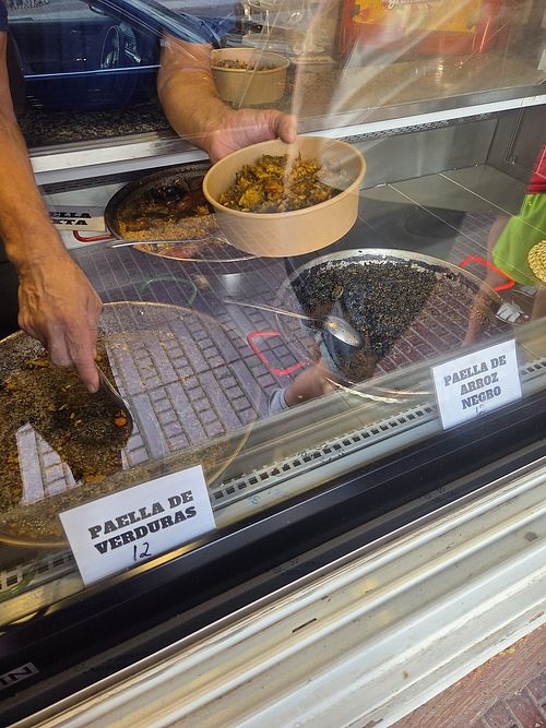 The vegetable Paella is on the left, served into good sized serving boxes! at Doña Paella en Ibiza in Ibiza