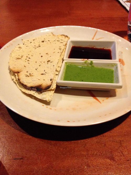 Papadum (lentil crackers), served with tamarind & mint chutney (after being told the chutney was vegan, later discovered it has yogurt!) at Karaikudi Palace in Scottsdale