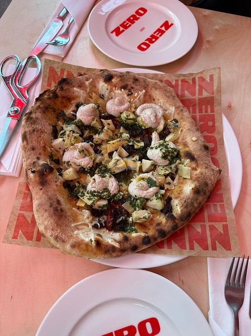 Vegan pizza. Delicious crust, tasty toppings. It's a bit oily,  but worth a try. at ZERO ZERO in Województwo Pomorskie