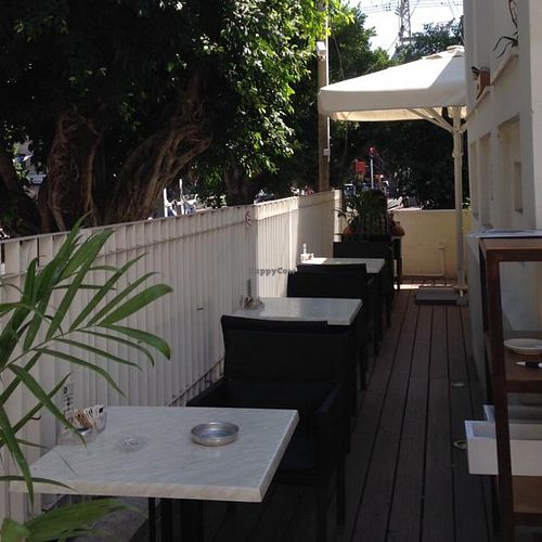 Outdoor seating at Lechem Erez in Kfar Saba