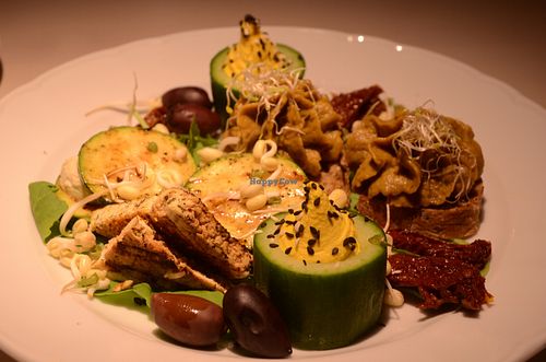 Snack Platter (Part 2)-- fava bean & mushroom pâté, fried tofu, cucumber cups with cashew cream, grilled zucchini with cashew cheese, sun-dried tomatoes, olives at Vegan Restoran V in Tallinn