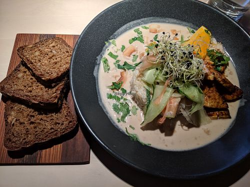 Orange-flavoured tempeh, brown rice, coconut-peanut sauce at Vegan Restoran V in Tallinn