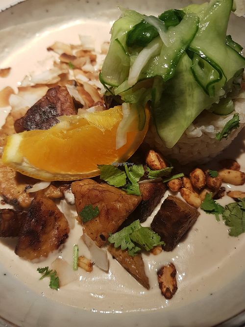 Tempeh with brown basmati rice and coconut-peanut sauce at Vegan Restoran V in Tallinn