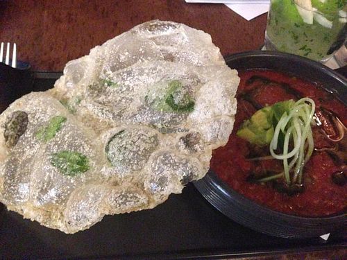 Tomato/avocado gazpacho with cucumber vermicelli and crunchy basil rice paper and herb oil at Vivo Bar and Grill in Palm Cove