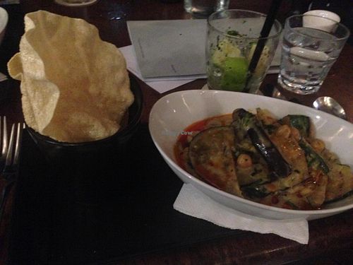Green chickpea curry with chargrilled zucchini/eggplant and crisp pappadams. at Vivo Bar and Grill in Palm Cove