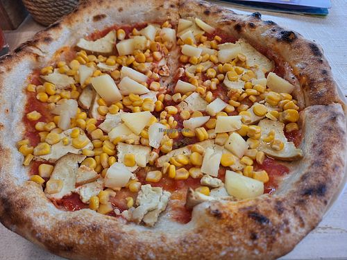 Vegan pizza with tofu, green pea protein, corn, pineapple. at Pelso di Napoli in Balatonlelle