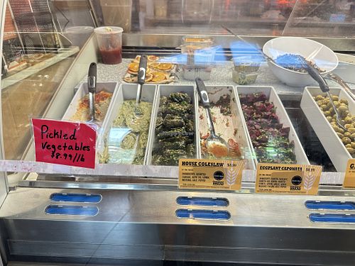 Many cold deli options, several marked Vegan  at Our Daily Bread Deli in Chatham