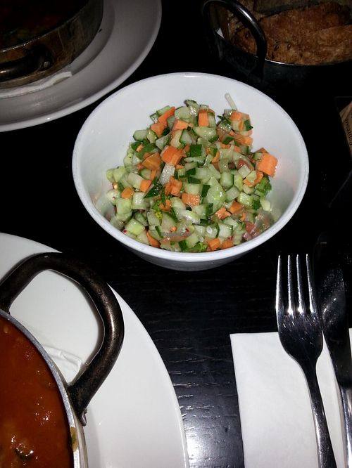 Israeli Salad comes with the Vegetable-patty in Tomato,  plus  Tahini, plus Olives at Café Schneor in Tel Aviv