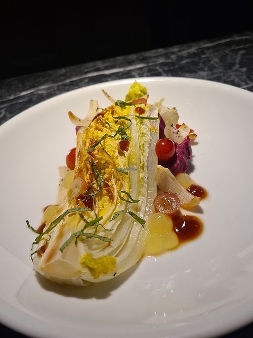 Main course: oven-roasted chinese cabbage with purple sweet potato purée and marinated grapes at Vaust Bar & Restaurant in Berlin