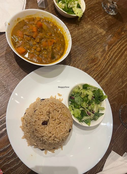 Chickpea Chana with rice & peas & salad   at Dolphin's Caribbean Restaurant & Bar in Reading