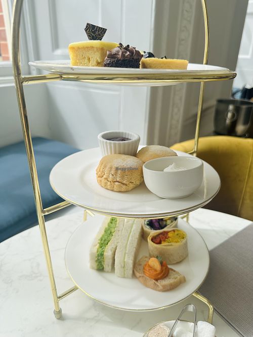 Sandwiches, cakes, scones with cream and jam  at The Orangery at Kensington Palace in London