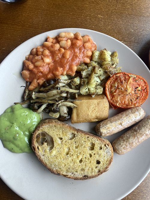 Full vegan breakfast. Sausages, tofu, onoki mushrooms, tomato, homemade beans, avocado smash, fried potatoes and fabulous homemade bread    at The Sheffield Bolthole in Sheffield