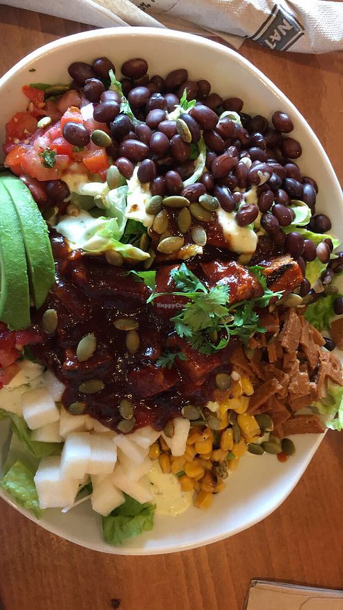 I can't remember the exact name but this is a BBQ chicken salad  at Native Foods - Point Loma in San Diego