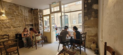 A few seats inside and in front of the store. at VESTIGES in Paris