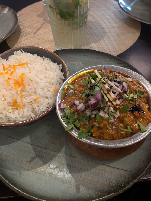 Baingain Bharta: vegan grilled Eggplant puree with rice    at DesiLicious Tandoor & Bar Dreieich in Dreieich