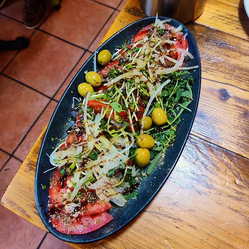 Ensalada de la casa (beef tomato salad) at Casa Naranjo in England