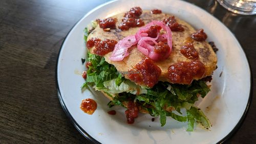 The Gordita is awesome! Ask no cheese or crema, sub cauliflower chorizo, add extra pickled red onions and hot sauce! at Fuego Tacos & Mezcal in Winchester