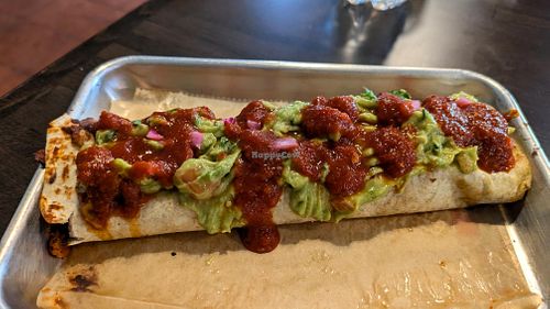 Cauliflower chorizo burrito with no cheese, rice, beans, added guac, pickled red onions, and hot sauce!  at Fuego Tacos & Mezcal in Winchester