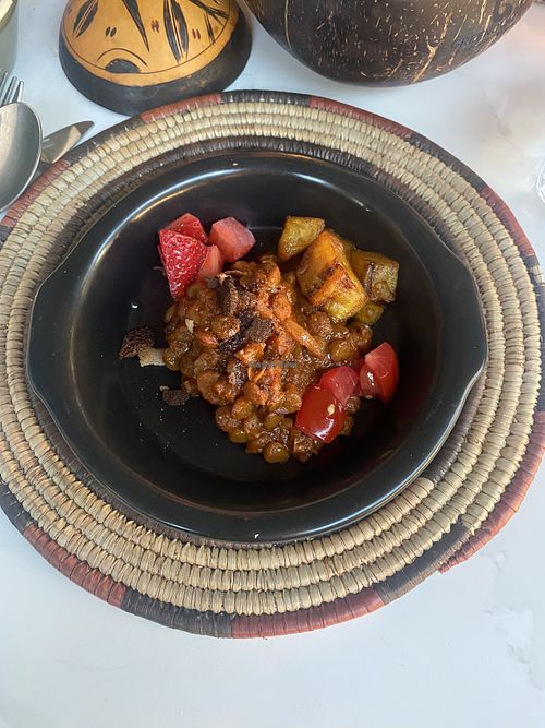 Lentils with deep fried plantains and fruit  at Yaya's Kitchen in London