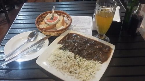 Champignones al jerez con arroz al perejil. at Soju in Santiago