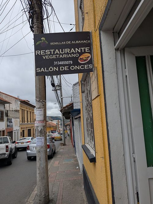 Exterior sign at street level at Semillas de Albahaca - Centro in Tunja