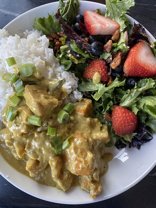 Vegan butternut squash curry with side salad  at Next Chapter Cafe in Bellingham