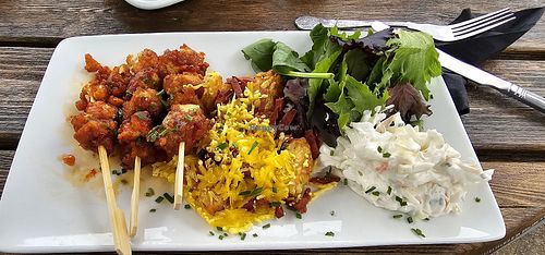 Gochugang Tofu skewers with loaded hash browns substituted in at Inn on the Lake  in Gravesend