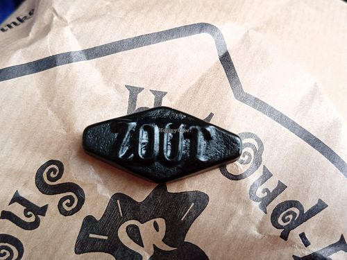 a piece of salty licorice (you can buy at least 50 grams in a paper package) at Het Oud-Hollandsch Snoepwinkeltje in Noord-holland