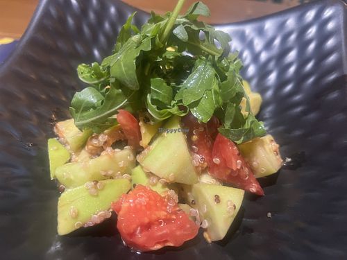 Green salad with quinoa, avocado, tomato and cucumber  at Cafe De Bobo in Dushanbe