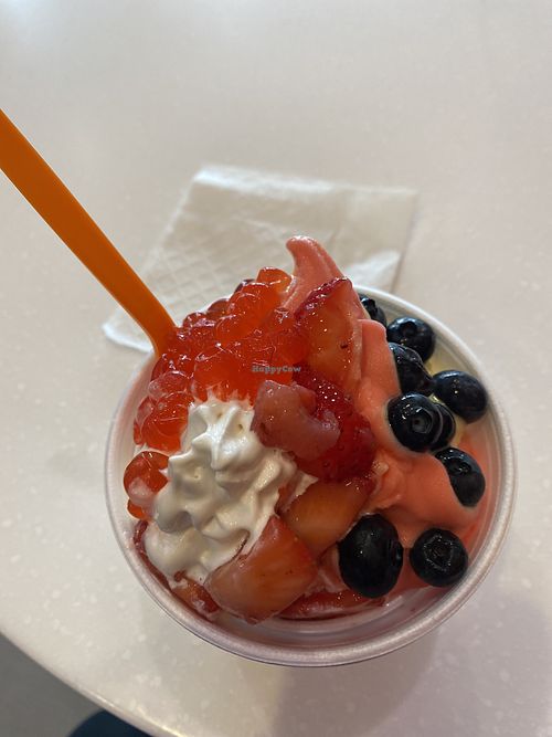 Aerial View of- Oat Vanilla, Watermelon Pineapple, with fresh Strawberries and Blueberries and delightful Popping Bobba (Strawberry Flavor I Believe) 😋  at Yogurt Mill in Modesto
